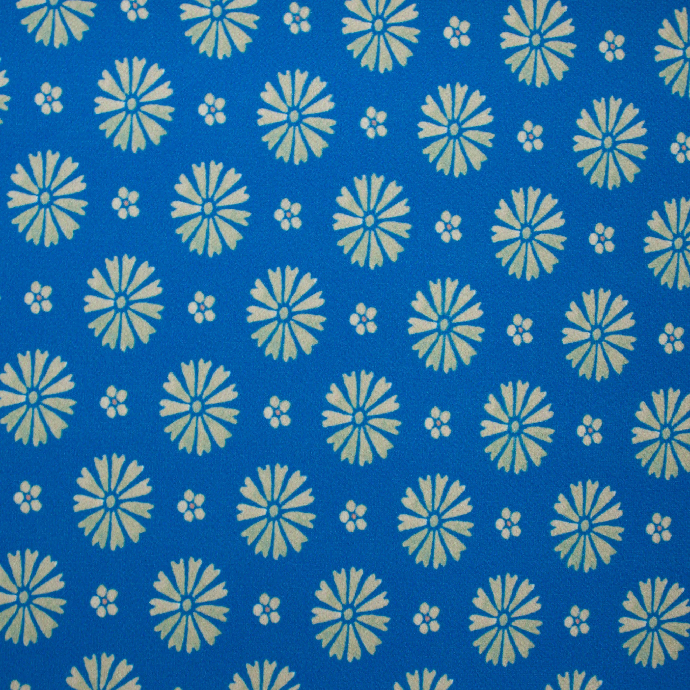 Polyester crepe blauw metgrijze bloemen